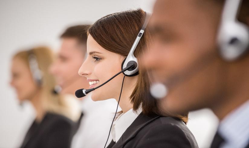 Smiling Call Center Representatives on Headsets